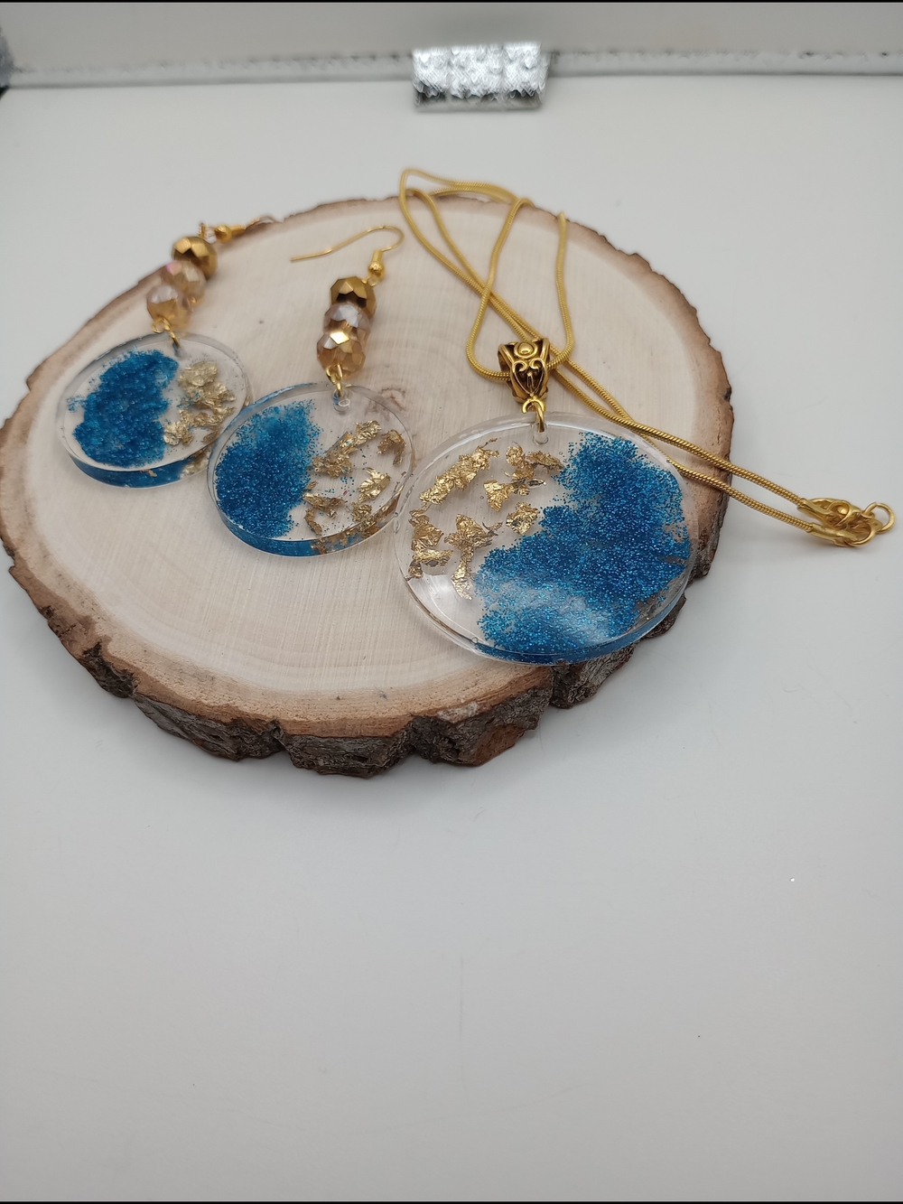 Handcrafted Blue Resin Pendant Necklace and Earrings Set with Gold Accents